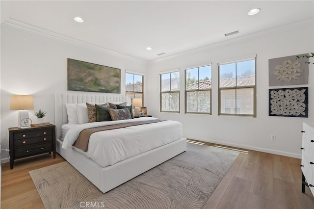 26 Los Indios, Irvine, CA 92618 - bedroom featuring crown molding, recessed lighting, and light wood-style flooring