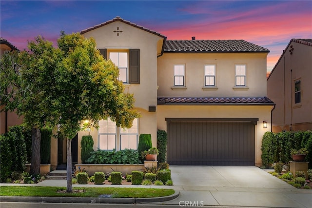 26 Los Indios, Irvine, CA 92618 - mediterranean / spanish home featuring a tiled roof, an attached garage, concrete driveway, and stucco siding