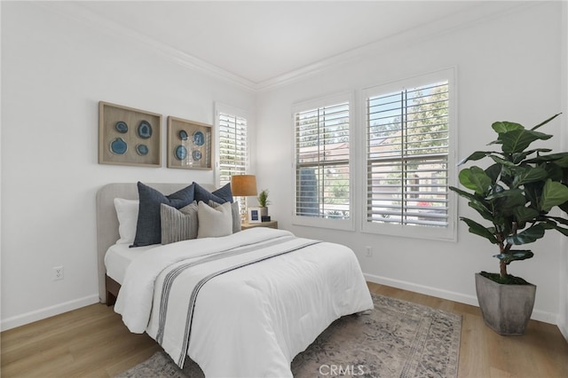 26 Los Indios, Irvine, CA 92618 - bedroom featuring multiple windows, crown molding, and wood finished floors