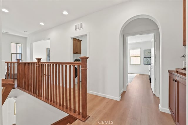 26 Los Indios, Irvine, CA 92618 - hallway with an upstairs landing, light wood-style floors, arched walkways, and recessed lighting