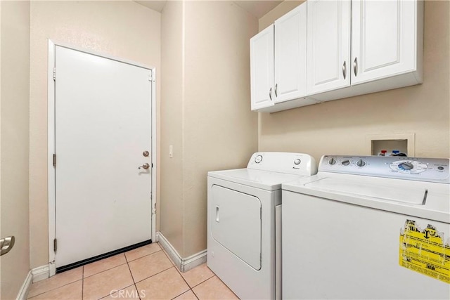 39423 Rowan Ct, Palmdale, CA 93551 - laundry area featuring cabinet space, washer and dryer, and light tile patterned floors