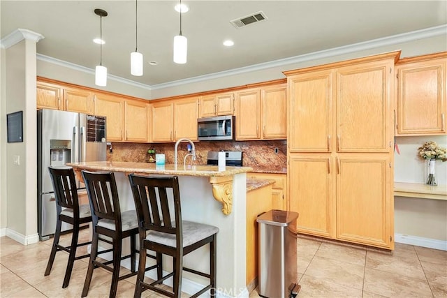 39423 Rowan Ct, Palmdale, CA 93551 - kitchen with appliances with stainless steel finishes, crown molding, light brown cabinetry, and decorative backsplash