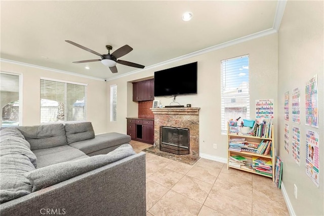 39423 Rowan Ct, Palmdale, CA 93551 - living room featuring crown molding, ceiling fan, a high end fireplace, light tile patterned flooring, and recessed lighting