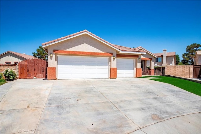 39423 Rowan Ct, Palmdale, CA 93551 - single story home featuring a gate, driveway, a garage, stucco siding, and a tile roof
