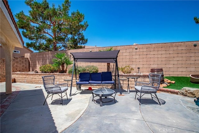 39423 Rowan Ct, Palmdale, CA 93551 - fenced backyard with a patio area and an outdoor living space with a fire pit