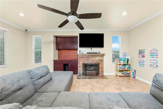 39423 Rowan Ct, Palmdale, CA 93551 - living area featuring light tile patterned floors, crown molding, ceiling fan, a fireplace, and recessed lighting