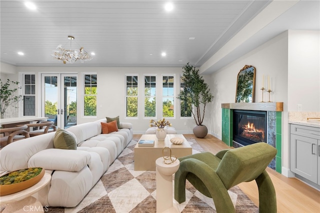 600 Baldwin Ct, Sierra Madre, CA 91024 - living area with french doors, a fireplace, recessed lighting, light wood-style floors, and a chandelier