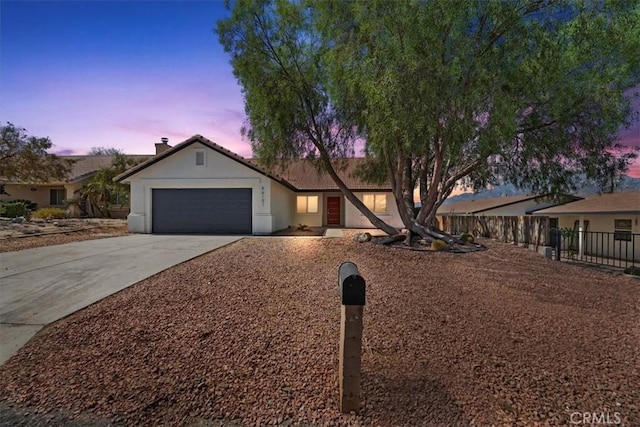 66101 14th St, Desert Hot Springs, CA 92240 - single story home with an attached garage, concrete driveway, stucco siding, and a tiled roof
