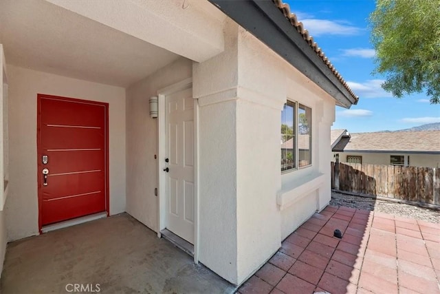 66101 14th St, Desert Hot Springs, CA 92240 - doorway to property with stucco siding and a patio