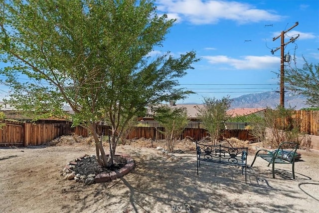 66101 14th St, Desert Hot Springs, CA 92240 - fenced backyard with a patio area and a mountain view