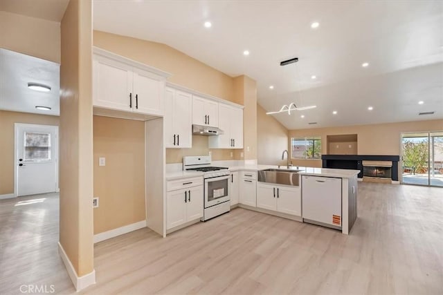 66101 14th St, Desert Hot Springs, CA 92240 - kitchen featuring white appliances, under cabinet range hood, lofted ceiling, light wood finished floors, and white cabinetry