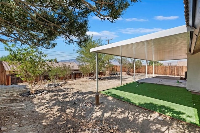 66101 14th St, Desert Hot Springs, CA 92240 - fenced backyard with a patio area