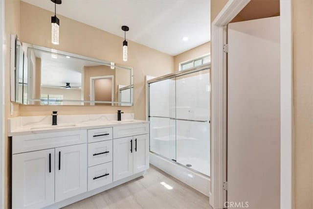 66101 14th St, Desert Hot Springs, CA 92240 - bathroom with ceiling fan, a stall shower, and double vanity