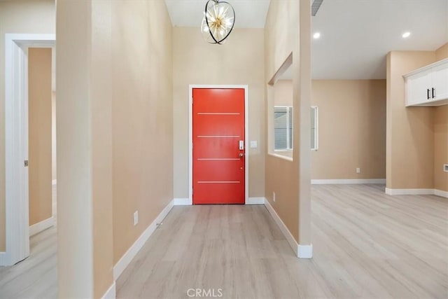 66101 14th St, Desert Hot Springs, CA 92240 - entrance foyer with light wood finished floors and a chandelier