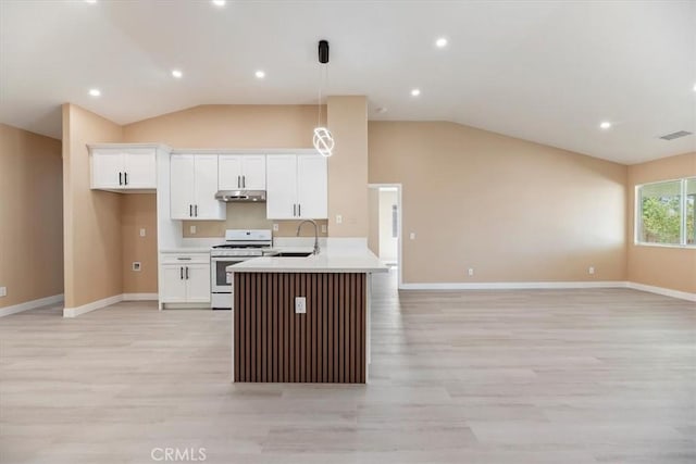 66101 14th St, Desert Hot Springs, CA 92240 - kitchen featuring white gas range, open floor plan, lofted ceiling, light wood-style flooring, and white cabinetry