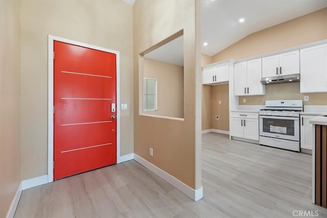 66101 14th St, Desert Hot Springs, CA 92240 - foyer with light wood-type flooring and lofted ceiling