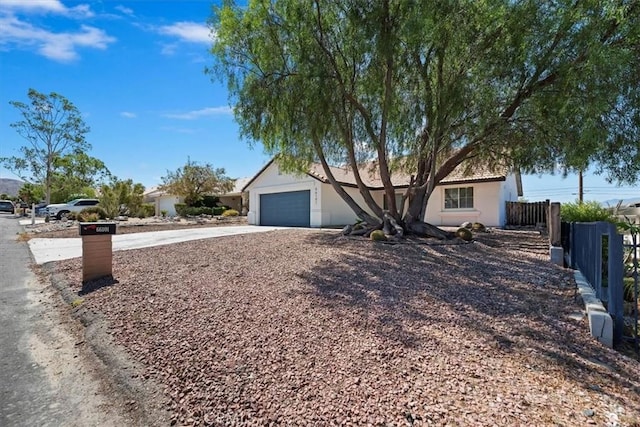 66101 14th St, Desert Hot Springs, CA 92240 - view of front of property featuring concrete driveway, a garage, and stucco siding
