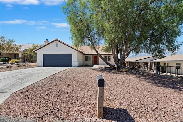66101 14th St, Desert Hot Springs, CA 92240 - ranch-style house featuring concrete driveway, a garage, stucco siding, a tiled roof, and a chimney