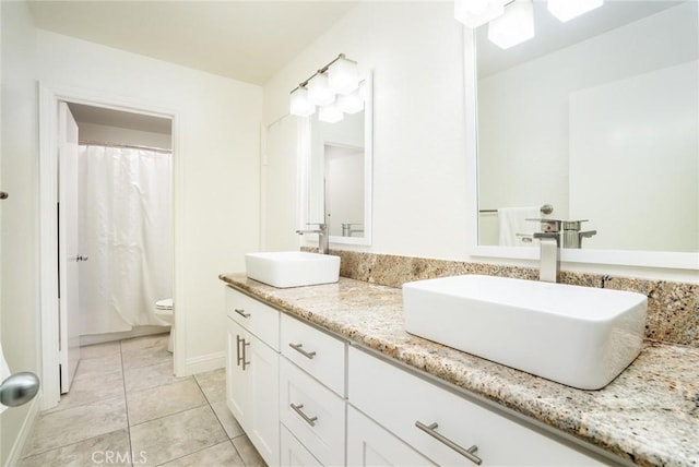 16521 Grunion Ln Unit 207, Huntington Beach, CA 92649 - full bathroom featuring double vanity and tile patterned flooring