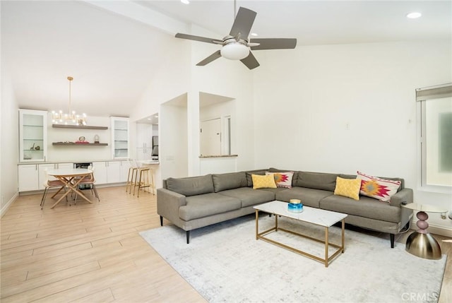 16521 Grunion Ln Unit 207, Huntington Beach, CA 92649 - living area featuring light wood-type flooring, a ceiling fan, high vaulted ceiling, a chandelier, and recessed lighting