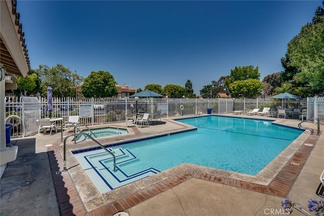 16521 Grunion Ln Unit 207, Huntington Beach, CA 92649 - community pool with a patio area and a hot tub