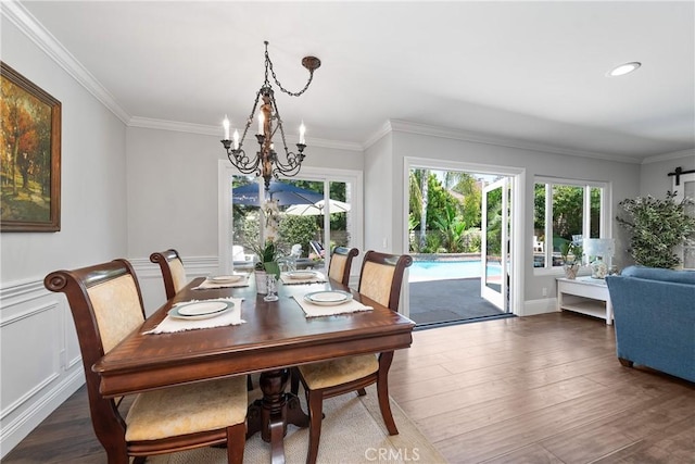 968 Saddlehorn Pl, Newbury Park, CA 91320 - dining room with a chandelier, wood finished floors, ornamental molding, and a wainscoted wall
