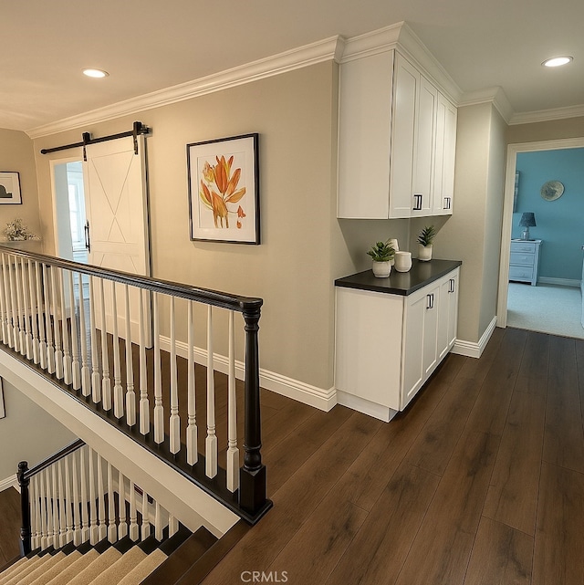 968 Saddlehorn Pl, Newbury Park, CA 91320 - bar area featuring dark wood-style flooring, a barn door, crown molding, and recessed lighting