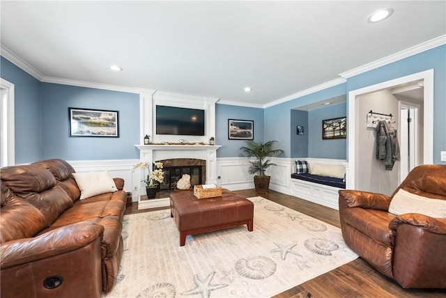 968 Saddlehorn Pl, Newbury Park, CA 91320 - living room with a premium fireplace, wood finished floors, recessed lighting, ornamental molding, and wainscoting