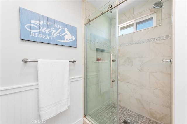968 Saddlehorn Pl, Newbury Park, CA 91320 - full bathroom featuring a shower stall, wainscoting, and a decorative wall