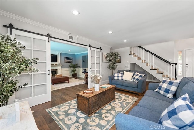 968 Saddlehorn Pl, Newbury Park, CA 91320 - living room with a barn door, stairway, crown molding, dark wood-style flooring, and recessed lighting