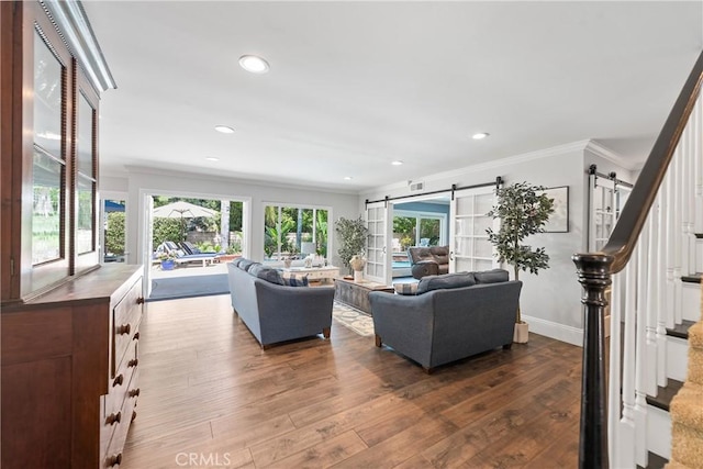 968 Saddlehorn Pl, Newbury Park, CA 91320 - living area with crown molding, dark wood-style floors, a barn door, recessed lighting, and stairway
