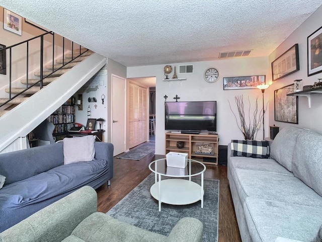 12553 Mapleview St Unit 28, Lakeside, CA 92040 - living room with wood finished floors, stairway, and a textured ceiling