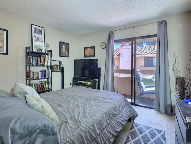 12553 Mapleview St Unit 28, Lakeside, CA 92040 - bedroom featuring access to exterior, carpet floors, and a textured ceiling