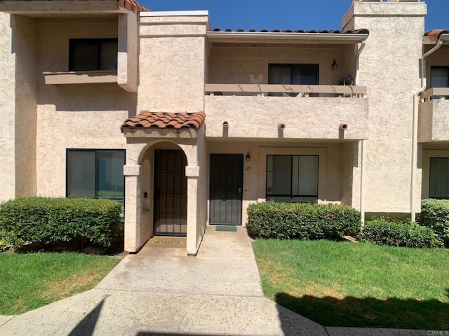 12553 Mapleview St Unit 28, Lakeside, CA 92040 - view of front of house with stucco siding and a tiled roof