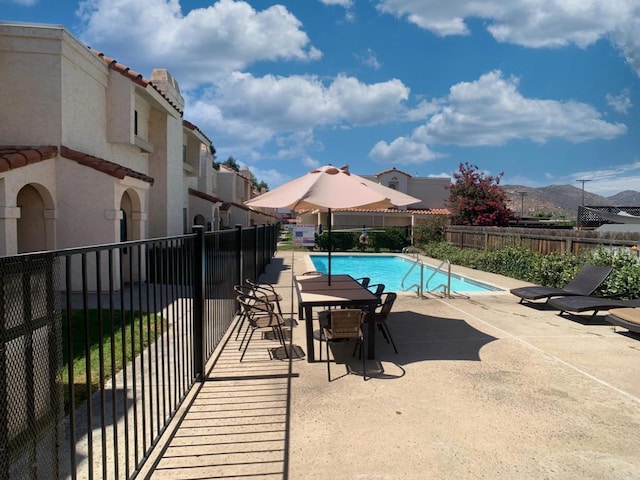 12553 Mapleview St Unit 28, Lakeside, CA 92040 - view of swimming pool featuring a patio and a mountain view