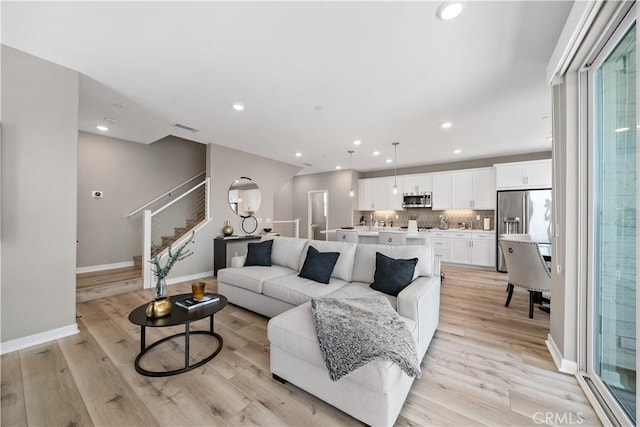 2890 Via Alta Pl, San Diego, CA 92108 - living area with stairs, light wood-style flooring, and recessed lighting