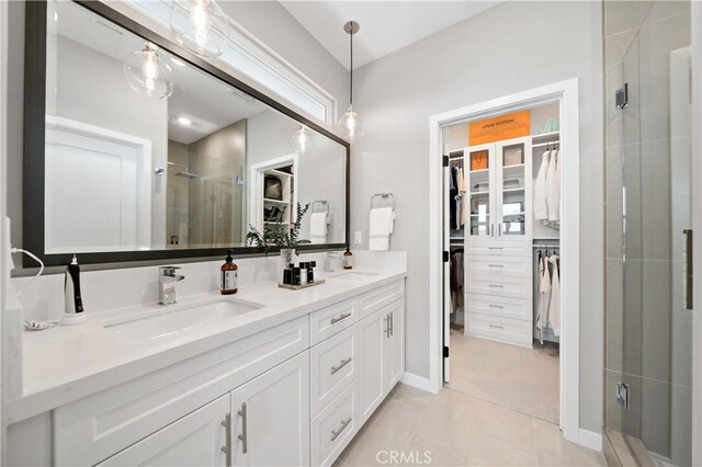 2890 Via Alta Pl, San Diego, CA 92108 - full bathroom featuring a walk in closet, a shower stall, double vanity, and tile patterned flooring