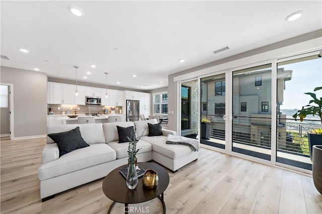 2890 Via Alta Pl, San Diego, CA 92108 - living room with light wood-type flooring and recessed lighting