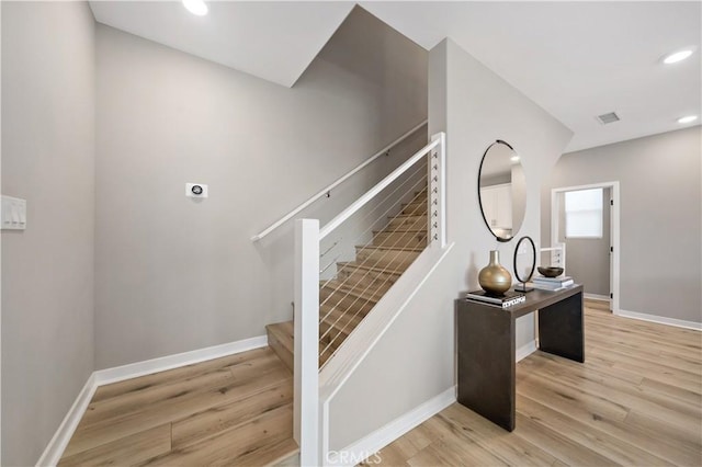 2890 Via Alta Pl, San Diego, CA 92108 - stairs with wood finished floors and recessed lighting