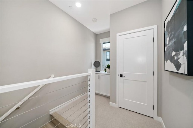 2890 Via Alta Pl, San Diego, CA 92108 - hallway featuring an upstairs landing and light carpet