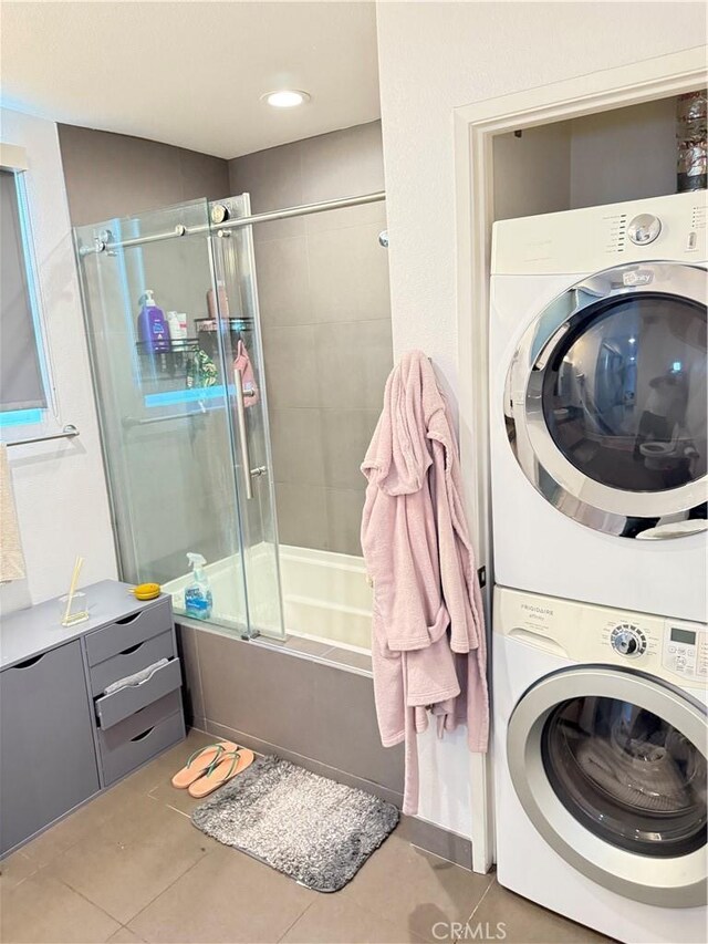 1234 Wilshire Blvd Unit 330, Los Angeles, CA 90017 - washroom with estacked washer and dryer and tile patterned floors