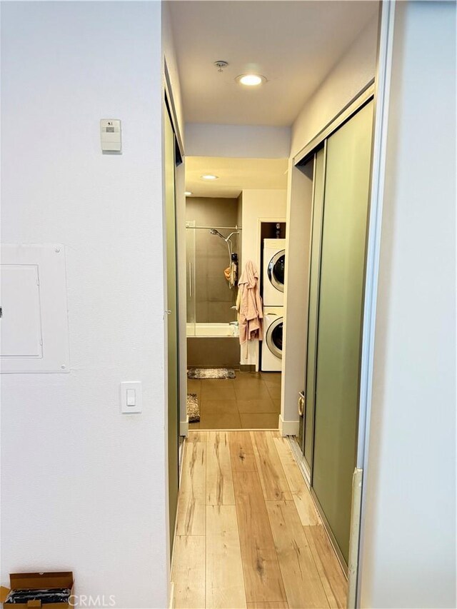 1234 Wilshire Blvd Unit 330, Los Angeles, CA 90017 - corridor with stacked washing machine and dryer, light wood-type flooring, and recessed lighting