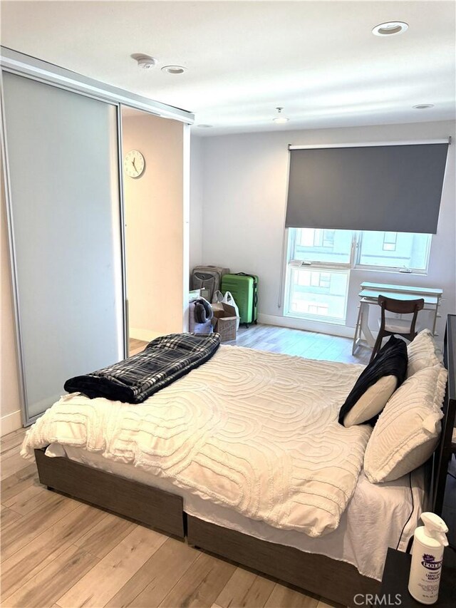 1234 Wilshire Blvd Unit 330, Los Angeles, CA 90017 - bedroom featuring wood finished floors, a closet, and recessed lighting