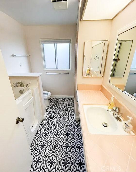 622 Esther Way, Redlands, CA 92373 - bathroom with vanity and a garden tub