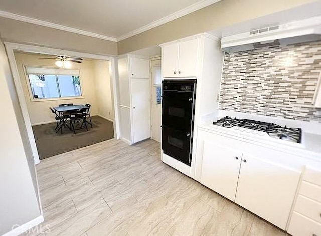 622 Esther Way, Redlands, CA 92373 - kitchen featuring crown molding, backsplash, white cabinets, white gas stovetop, and light countertops