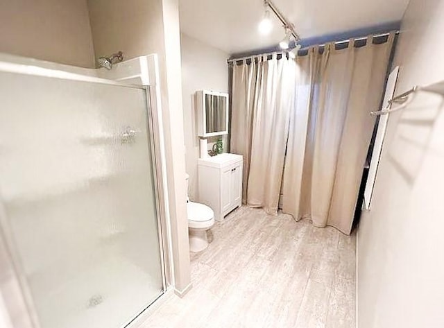622 Esther Way, Redlands, CA 92373 - bathroom with a stall shower and wood finished floors