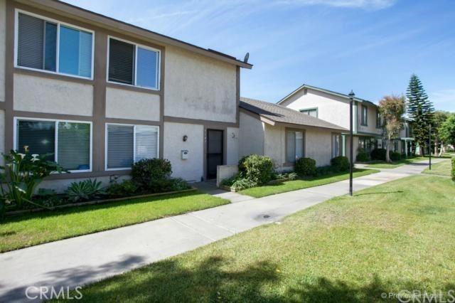 7147 Fulton Way, Stanton, CA 90680 - view of front facade featuring a front yard and stucco siding