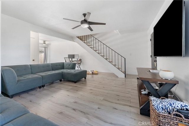 7147 Fulton Way, Stanton, CA 90680 - living area featuring a ceiling fan, stairway, and light wood finished floors