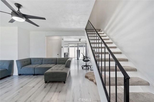 7147 Fulton Way, Stanton, CA 90680 - living area with a ceiling fan, stairway, and wood finished floors