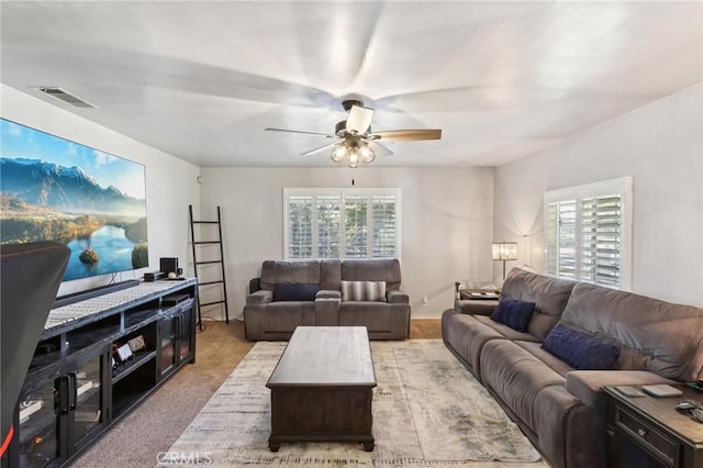 1776 San Bernardino Ave, Pomona, CA 91767 - carpeted living room with a ceiling fan and healthy amount of natural light